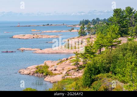 Visitors enjoy boating activities in Georgian Bay, Killarney Provincial Park, Ontario, Canada Stock Photo