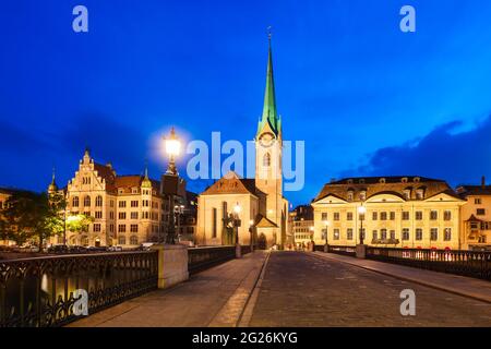 Fraumunster Church and Munsterbrucke bridge through Limmat river in the centre of Zurich city in Switzerland Stock Photo