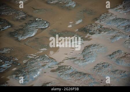 Wet cobblestones at night after rain on a street or road surface Stock Photo