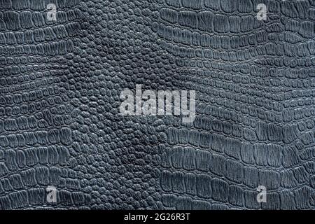 Background image - dark gray leather with crocodile skin texture. Stock Photo