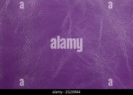 The background image is purple leather with an abstract texture. Stock Photo