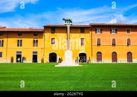 The Capitoline Wolf or Lupa Capitolina is a bronze sculpture near the Pisa Leaning Tower at Piazza dei Miracoli or Square of Miracles in Pisa, Italy Stock Photo