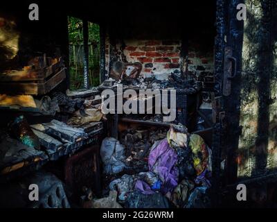 Burnt old house interior. Consequences of fire. Stock Photo