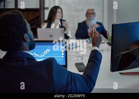 A man standing in front of a computer Stock Photo