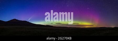 Panorama of Comet NEOWISE and aurora over Waterton Lakes National Park, Alberta, Canada. Stock Photo