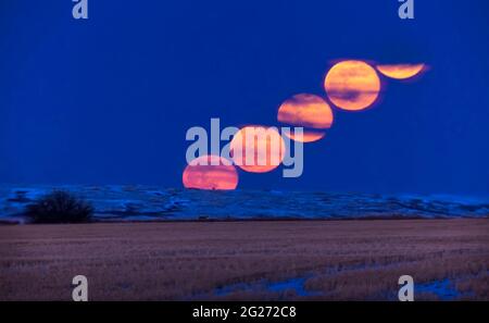 The rising of the full moon on March 9, 2020. Stock Photo