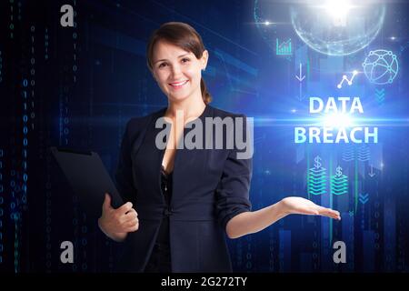 Business, Technology, Internet and network concept. Young businessman working on a virtual screen of the future and sees the inscription: Data breach Stock Photo