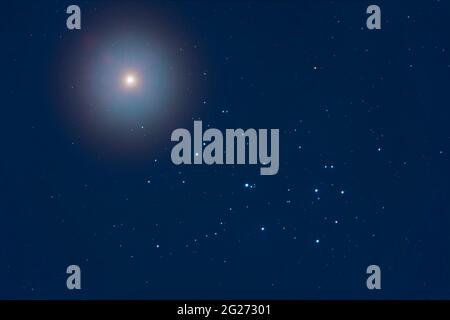 Venus above the Pleiades star cluster, M45, in the twilight and moonlight. Stock Photo