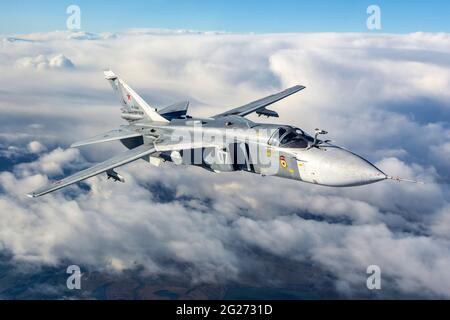 Su-24M frontline bomber plane of the Russian Navy flying over Kaliningrad Region, Russia. Stock Photo