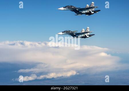 Su-30SM jet fighters of the Russian Navy flying in mid-air. Stock Photo