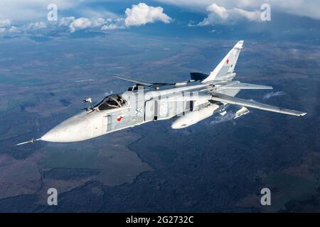 Su-24M frontline bomber plane of the Russian Navy flying over Kaliningrad Region, Russia. Stock Photo