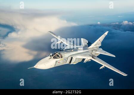 Su-24M frontline bomber plane of the Russian Navy flying over Kaliningrad Region, Russia. Stock Photo