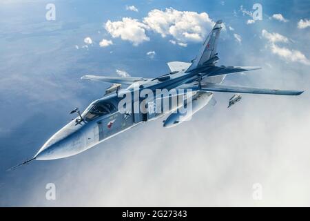 Su-24M frontline bomber plane of the Russian Navy flying over Kaliningrad Region, Russia. Stock Photo