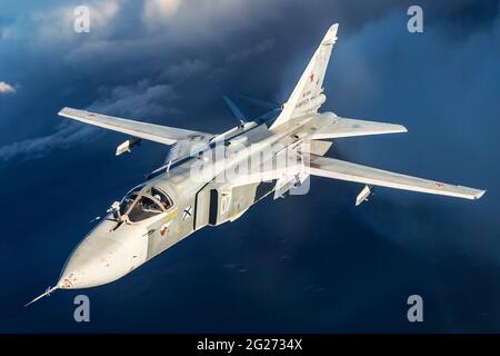 Su-24M frontline bomber plane of the Russian Navy flying over Kaliningrad Region, Russia. Stock Photo