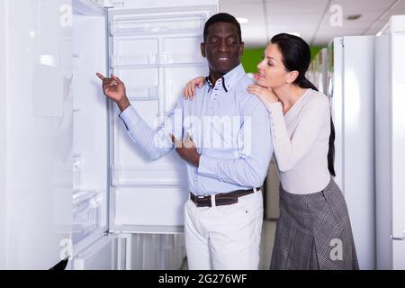 couple chooses refrigerator Stock Photo