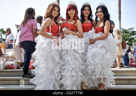 Frilly dress. Women wearing frilly skirts at an outdoor street parade event. Thailand Southeast Asia Stock Photo