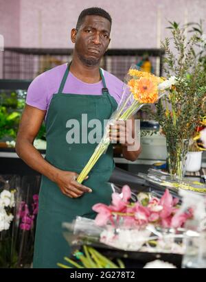 Dissatisfied owner of flower shop Stock Photo