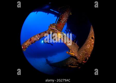 Scuba diver explores the wreck of the Hilma Hooker in Bonaire, Caribbean Sea Stock Photo