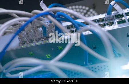 Network switch and ethernet cable in data center. Wifi plug of internet router for computer. Network hub. Communication networking wireless. Network Stock Photo