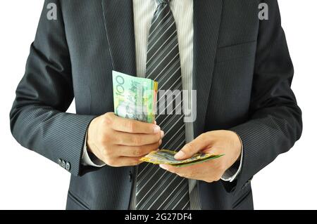 Businessman holding money  - Australian dollar bills Stock Photo