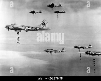 Airplanes of the U.S. Army Air Force dropping bombs on Lohne, Germany. Stock Photo