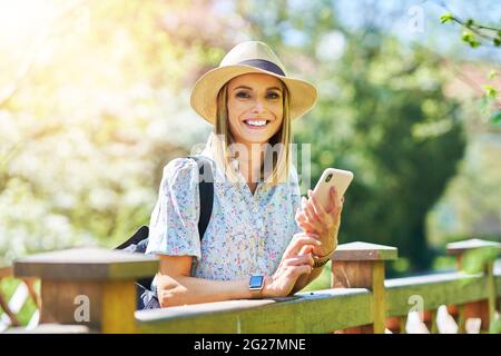 A woman with phone in the park  Stock Photo