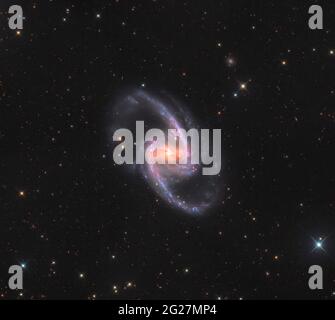 NGC 1365, a double-barred spiral galaxy in the constellation Fornax. Stock Photo