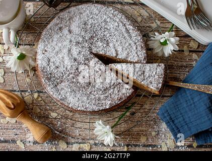 gluten free almond cake from spain served on rustic wooden table background isolated. Top view Stock Photo