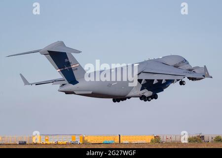A U.S. Air Force C-17 Globemaster III takes off from Fort Worth, Texas. Stock Photo