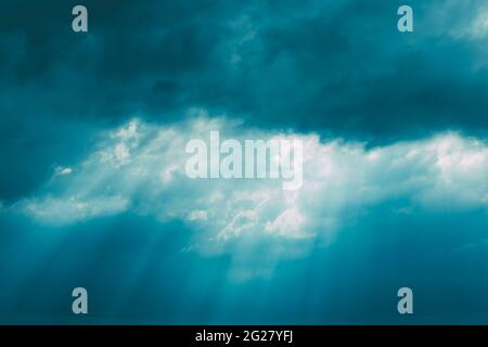 Sunrays Through Blue Rainy Dramatic Sky. Natural Abstract Background Stock Photo