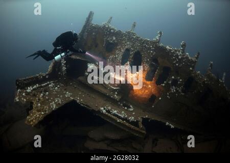 Diver exploring the RMS Justicia shipwreck off Malin Head, Ireland. Stock Photo