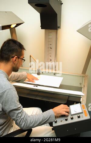 Man using scanner multifunction device in office Stock Photo