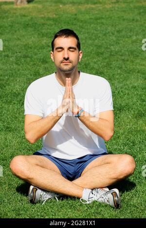 young man doing yoga in Stock Photo