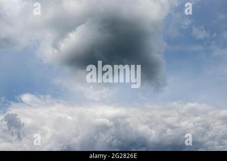 Big clouds in the sky before the summer thunderstorm. Clouds before the rain starts. Stock Photo
