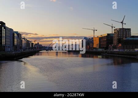 DUBLIN, IRELAND - Oct 27, 2019: Sunset over River Liffey in Dublin, Ireland with the Samuel Beckett Bridge in the frame. Stock Photo