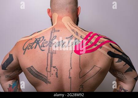 kinesio taping on the body, neck back in the salon Stock Photo