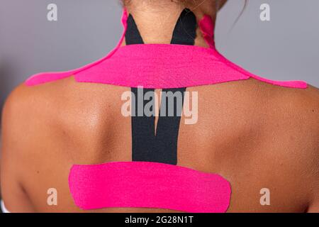 kinesio taping on the body, neck back in the salon Stock Photo
