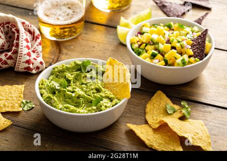 Tortilla chips with dips, guacamole and salsa Stock Photo