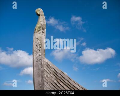 On a sunny day with light cloud, the prow of the Skidbladner - a full size replica of a Viking ship near Haroldswick on the island of Unst in Shetland Stock Photo