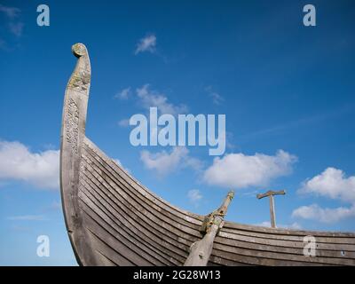 On a sunny day with light cloud, the prow of the Skidbladner - a full size replica of a Viking ship near Haroldswick on the island of Unst in Shetland Stock Photo