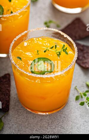 Pineapple and mango margarita with chips and guacamole Stock Photo