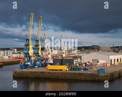 Two rail mounted, electric portal cranes at Atlantic Wharf in the Port of Aberdeen in Scotland, UK. Each has a capacity of up to 8 tonnes (grab) and u Stock Photo