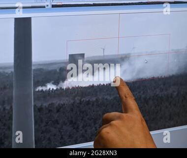 09 June 2021, Brandenburg, Wünsdorf: A forest fire can be seen on a computer screen in the Forest Fire Centre South of the Brandenburg State Forestry Office in Wünsdorf. With the rising temperatures, the danger of forest fires has increased in Brandenburg. Currently, forest fire danger level 4 is in effect throughout the state of Brandenburg. Two forest fire centers in Wünsdorf (Teltow-Fläming) and Eberswalde (Barnim) monitor the events in the state. From stage 3 onwards, they are manned. According to the Ministry of the Environment, last year there were 299 forest fires in Brandenburg on 118 Stock Photo