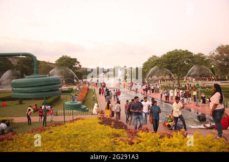 People walking in Brindavan Gardens with Fountains and Greenery in Mysore, Mandya, Karnataka, India Stock Photo