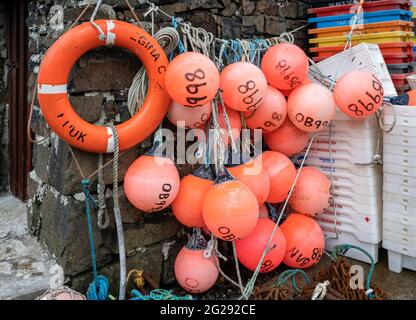 A colourful selection of buoys and fishing tackle at Croig harbour on the Isle of Mull Stock Photo