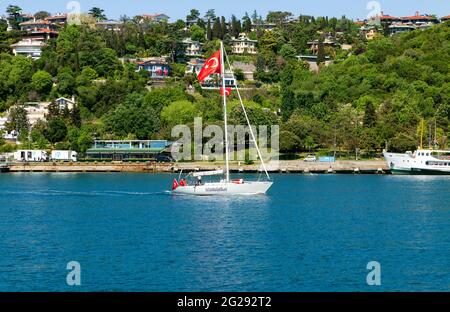 Kurucesme, Istanbul, Turkey May 19th, 2021: A sailboat of Istanbul Sailing Club at Bosphorus to celebrate May 19th Youth and Sports National Festival Stock Photo