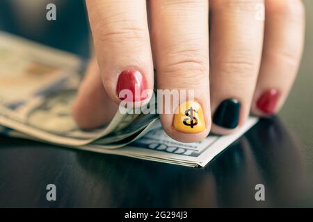 Hands counting us dollar bills. Business concept, counting money. A rich rapper with money. Men's manicure Stock Photo