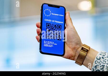 A corona passport with a QR code on a mobile phone at Rotterdam the Hague airport Netherlands on June 9 2021. With a corona passport digital Covid 19 certificate the EU wants to