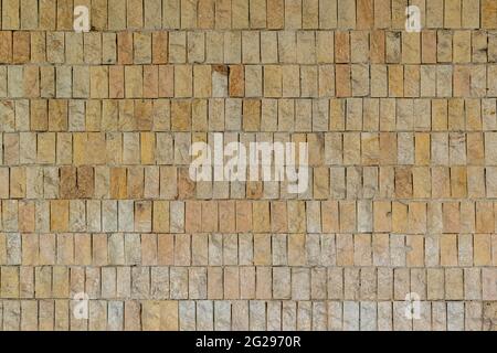 Stone wall of natural stones in different sizes. The facade of the house Stock Photo