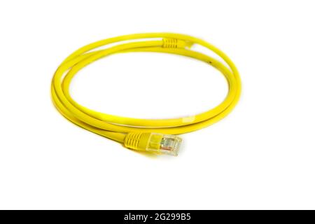 LAN network connection Ethernet RJ-45 cable yellow color. Stock Photo